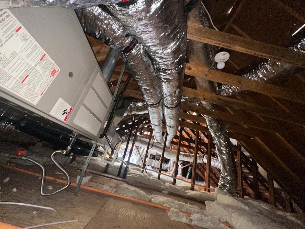 Attic floor with fresh blown-in insulation at depth