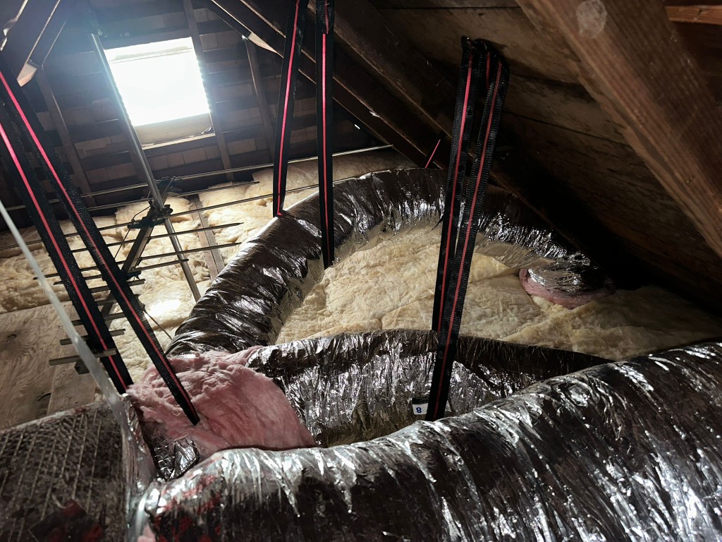 Los Angeles attic before Pure Eco cleaning — contaminated insulation and debris