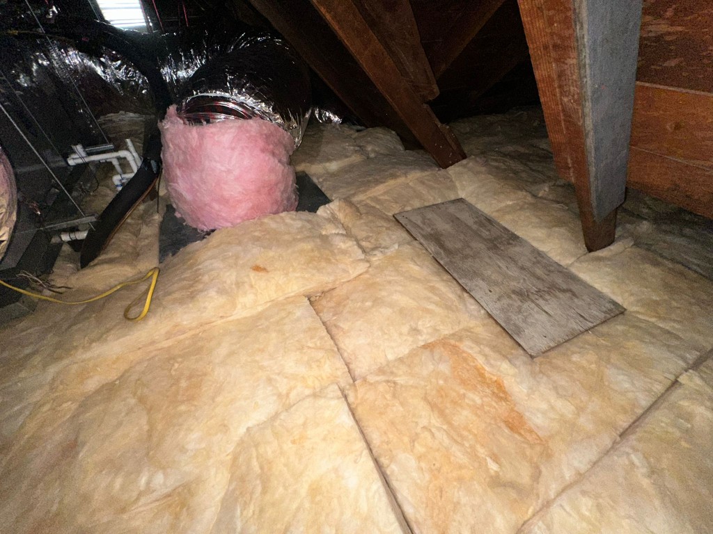 Los Angeles attic before Pure Eco cleaning — contaminated insulation and debris