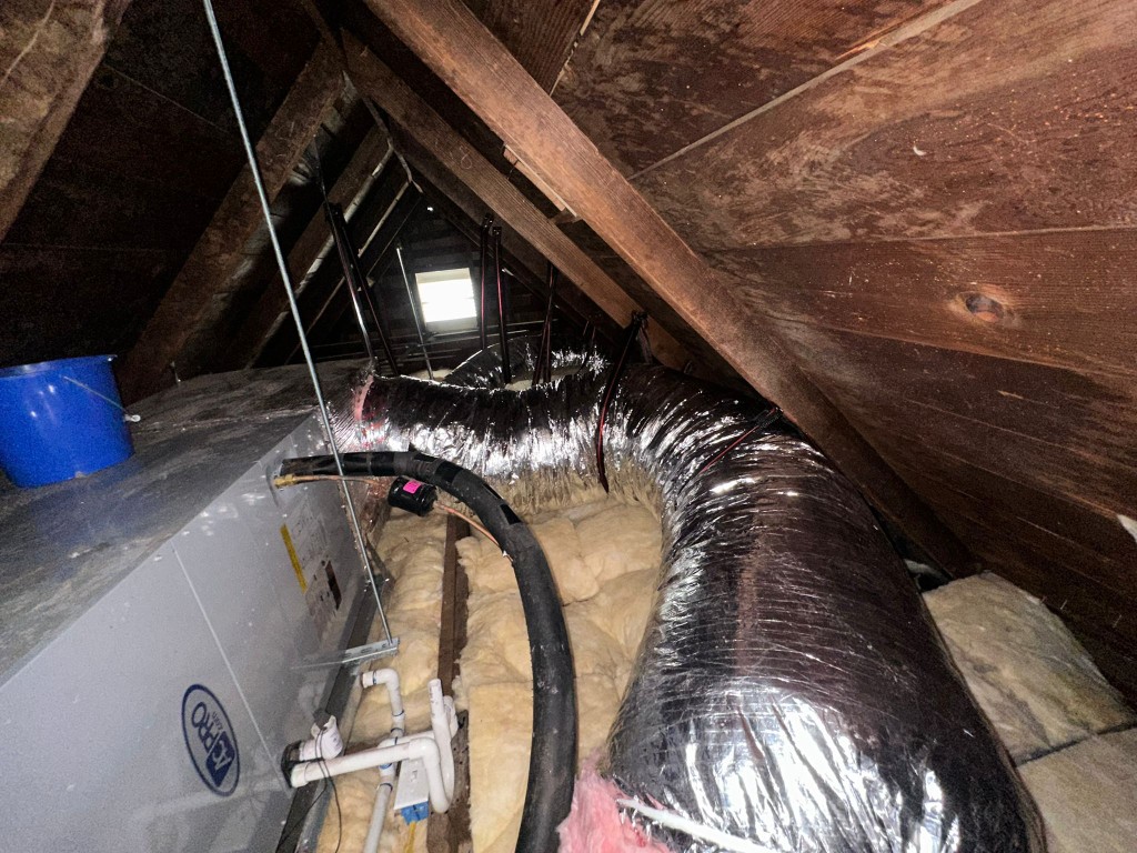 Los Angeles attic before Pure Eco cleaning — contaminated insulation and debris