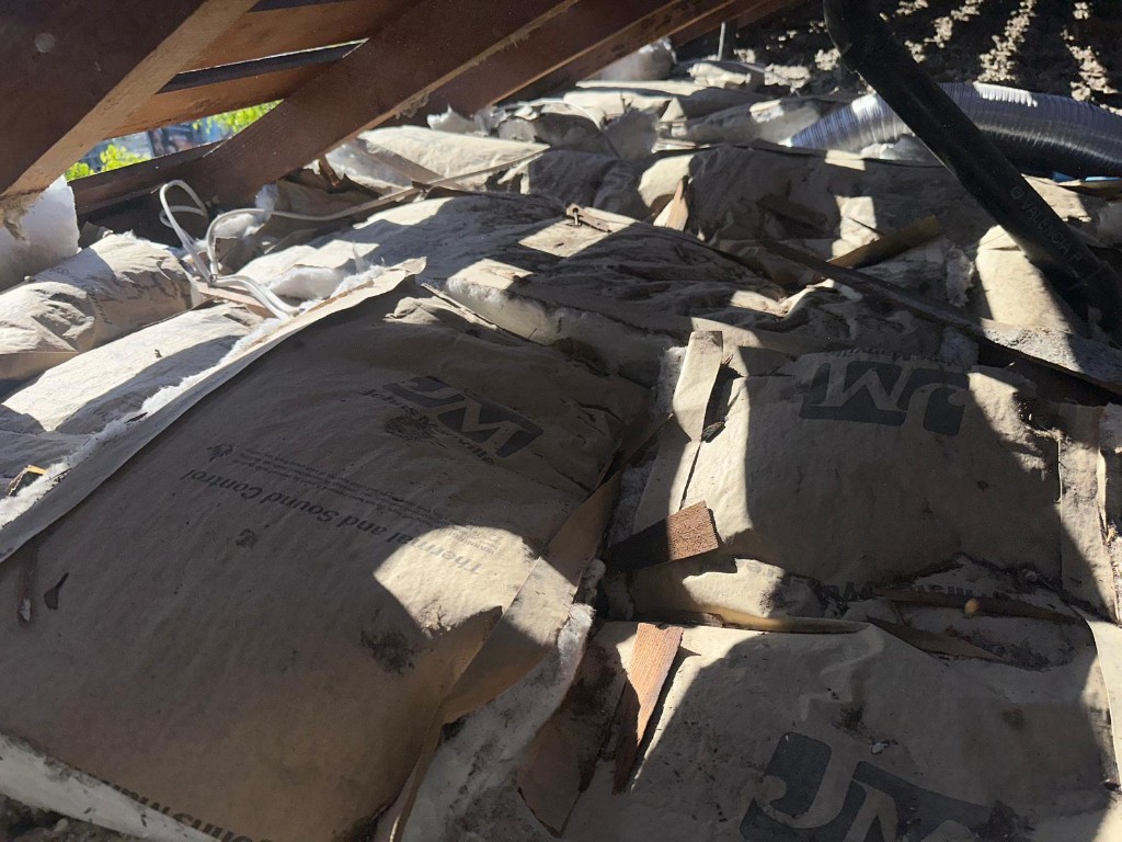 Los Angeles attic before Pure Eco cleaning — contaminated insulation and debris