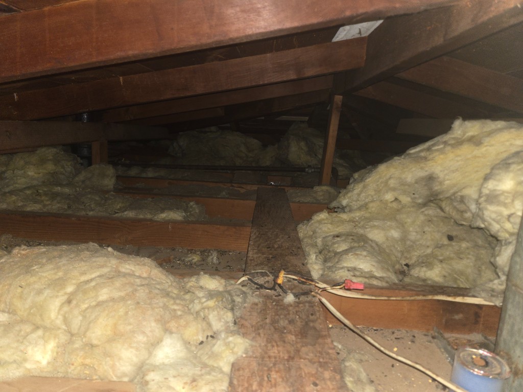 Torn, dirt-caked flexible ductwork before Pure Eco replacement