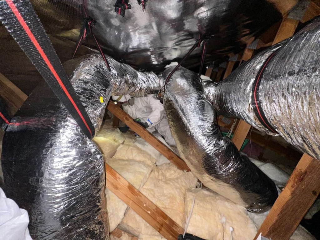 New insulated flex duct runs installed and supported in the attic