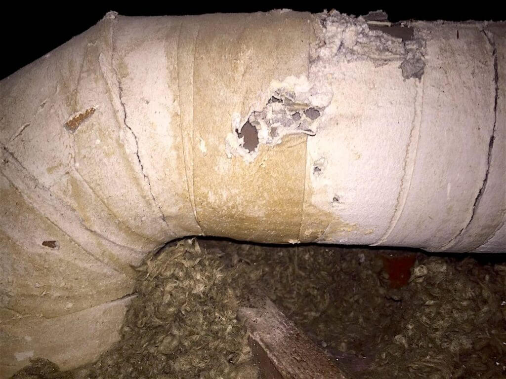 Torn, dirt-caked flexible ductwork before Pure Eco replacement