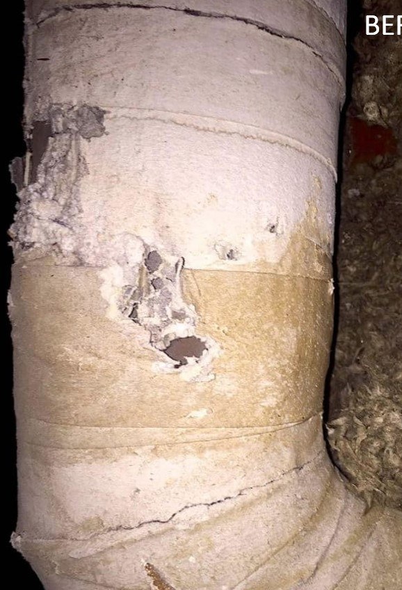 Torn, dirt-caked flexible ductwork before Pure Eco replacement