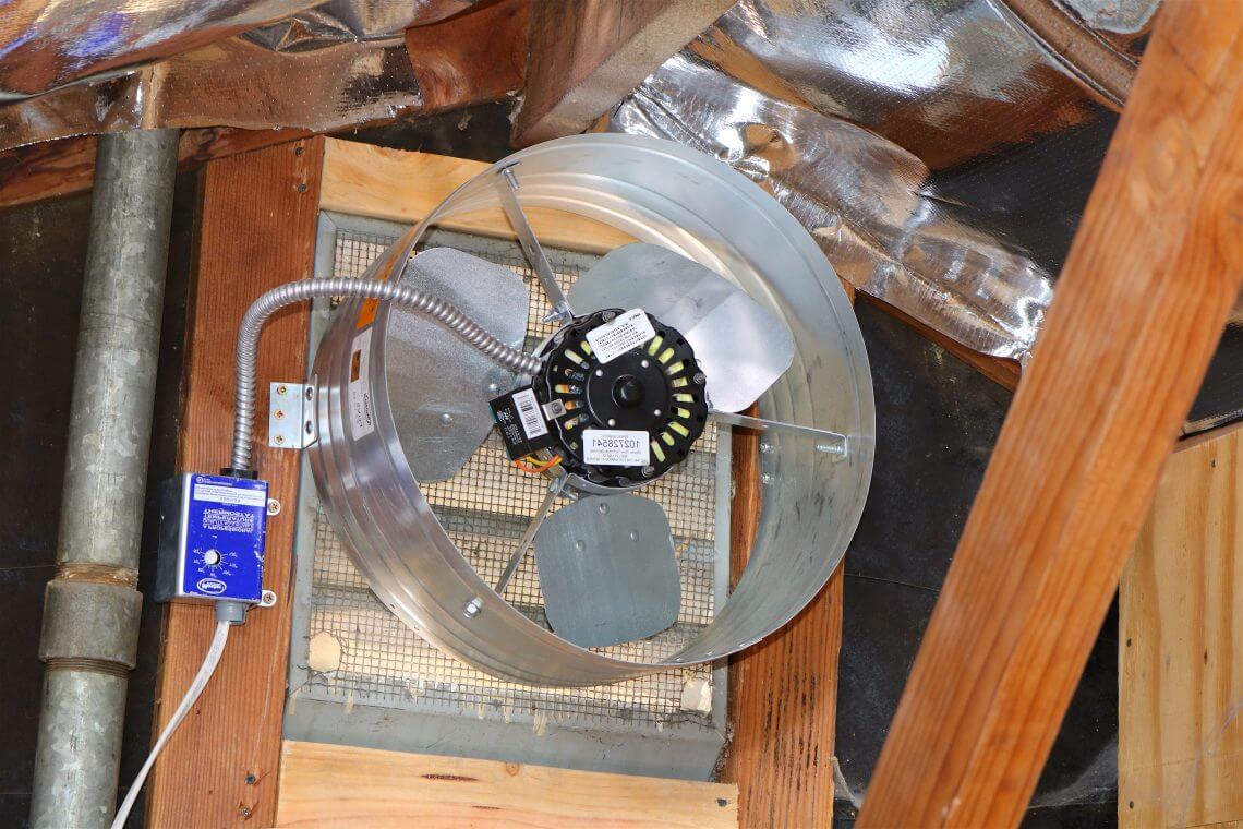 Completed attic fan install with controller wired and mounted