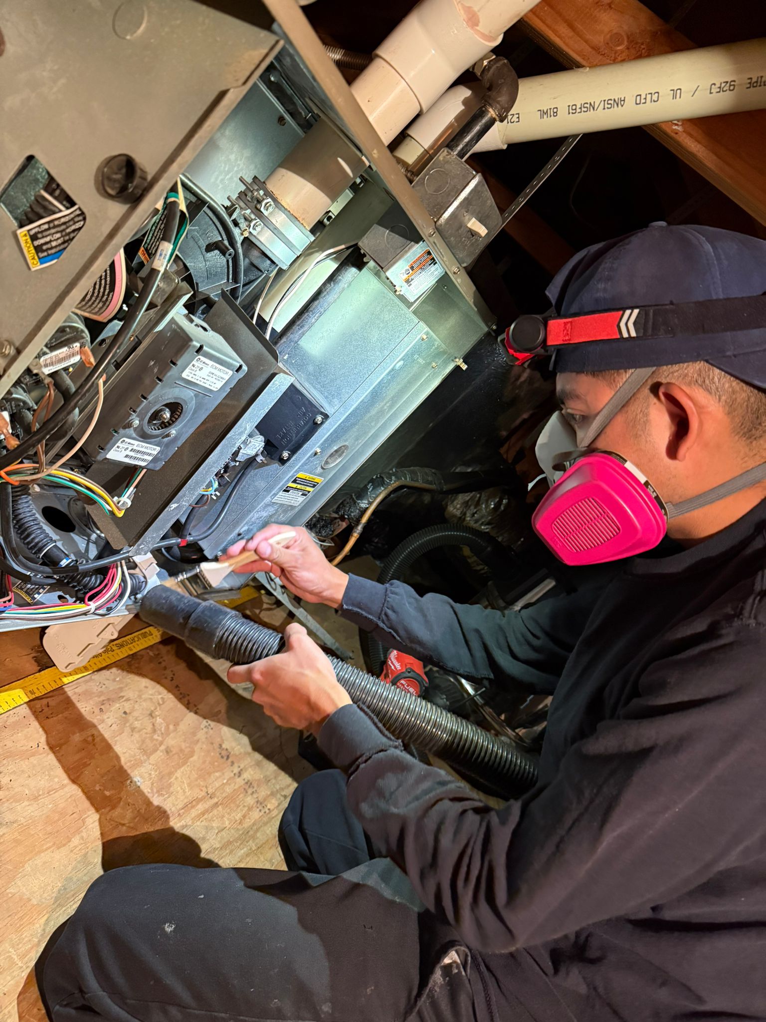 Pure Eco technician servicing HVAC equipment during a system swap