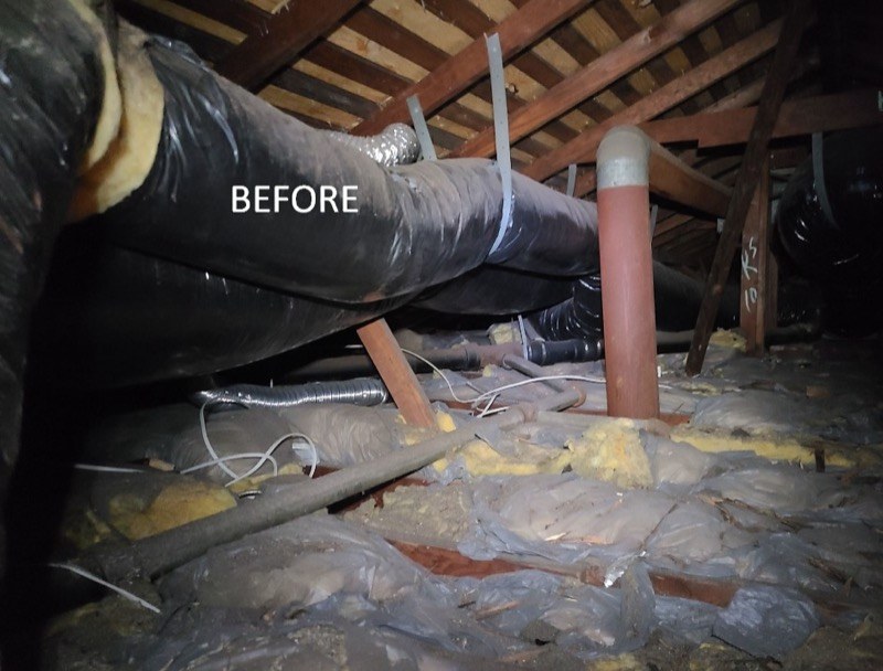 Attic with settled, contaminated batt insulation before Pure Eco replacement