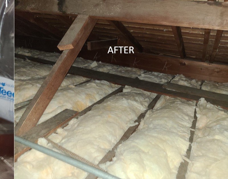 Attic with new fiberglass batt insulation installed to target R-value