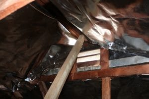 Radiant barrier fully installed across the attic roofline