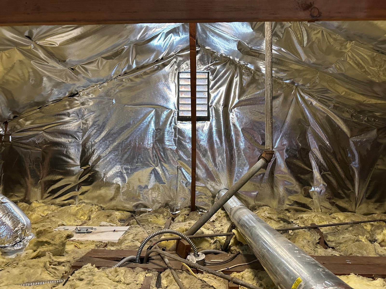 Radiant barrier fully installed across the attic roofline