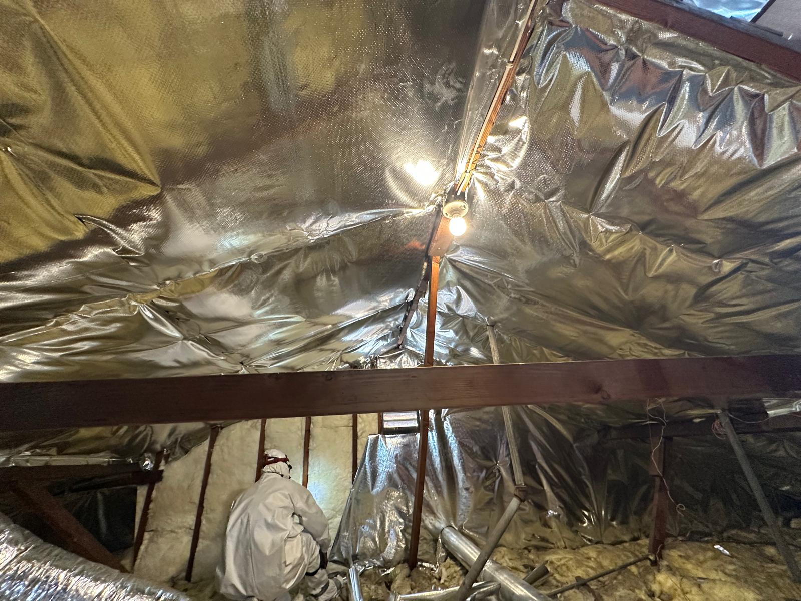 Radiant barrier fully installed across the attic roofline
