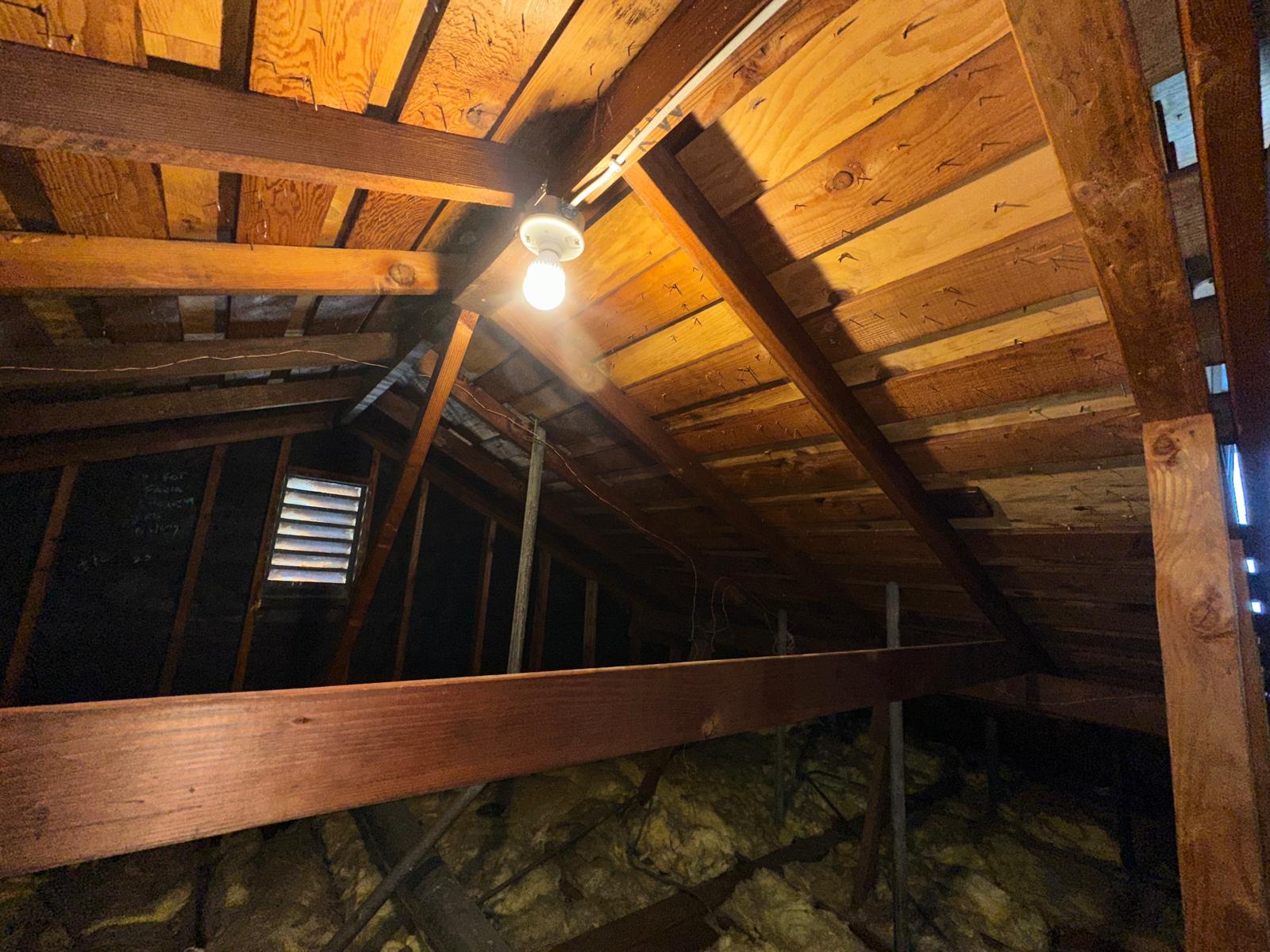 Bare attic roof deck before Pure Eco radiant barrier install
