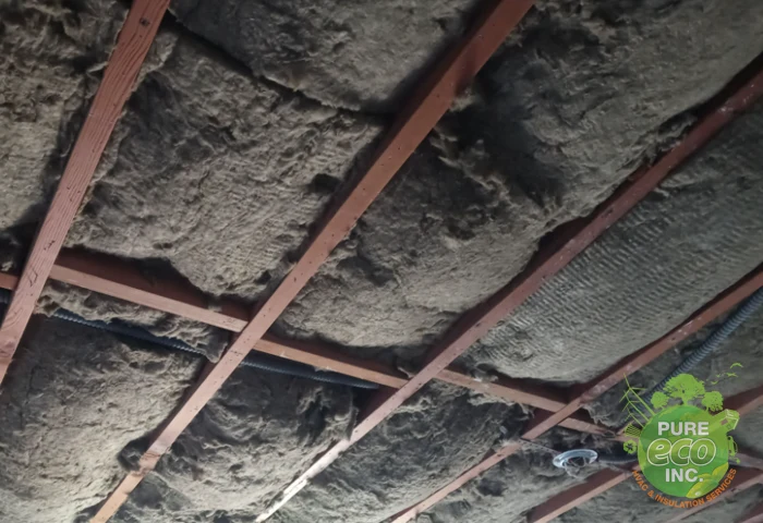 Ceiling cavity with old insulation before soundproofing work