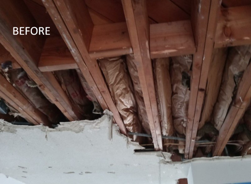 Ceiling cavity with old insulation before soundproofing work