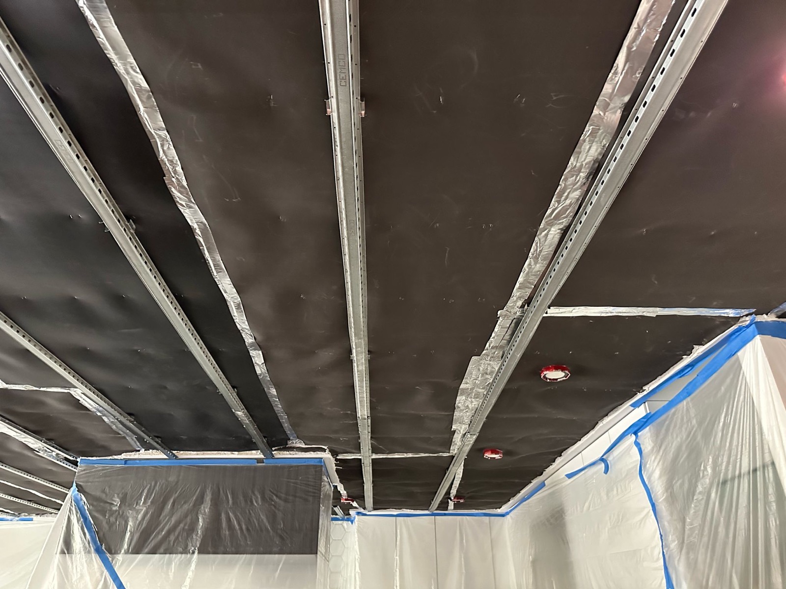 Mass-loaded vinyl and resilient channel soundproofing installed