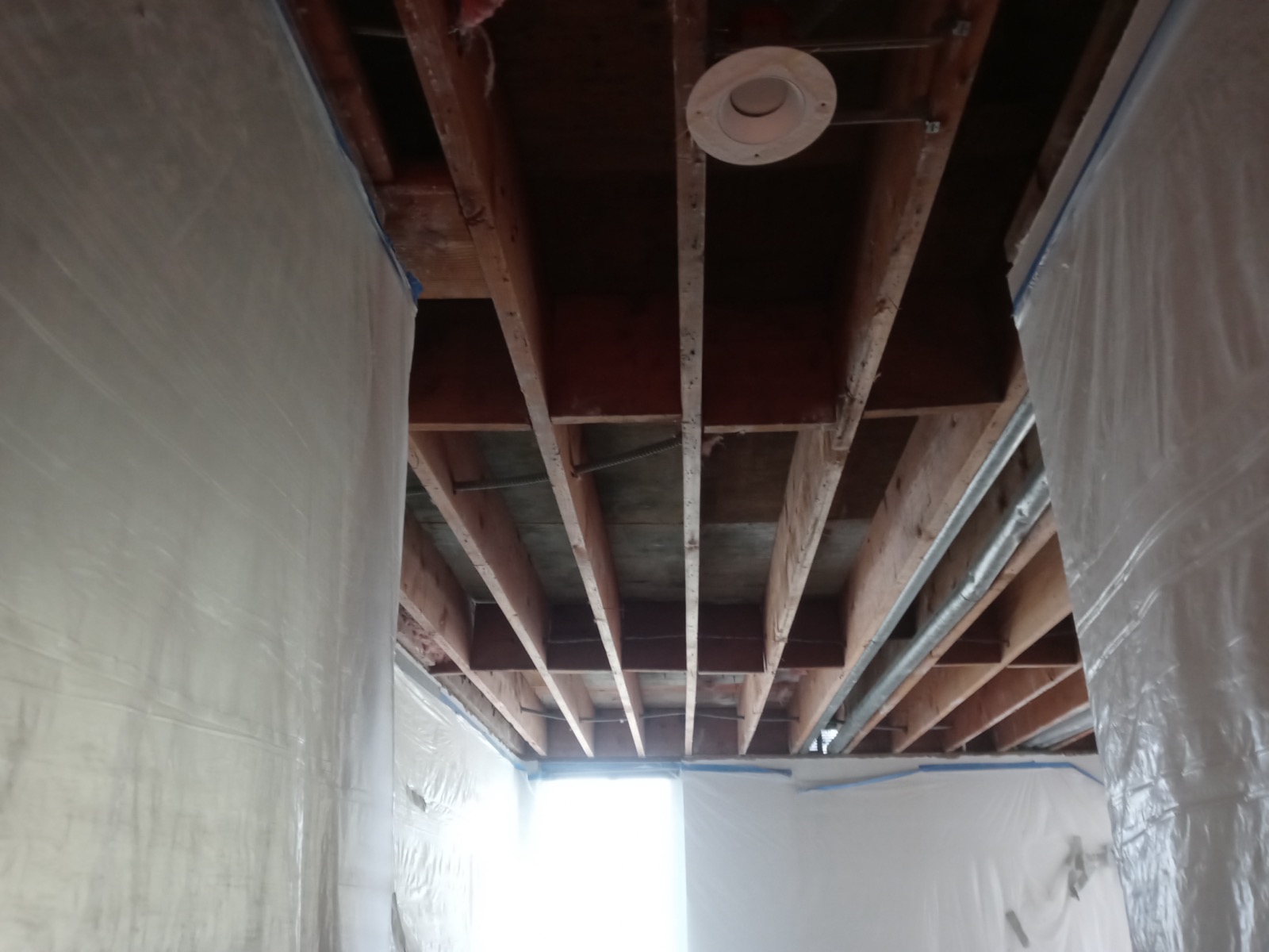 Room masked and framed for mass-loaded vinyl soundproofing