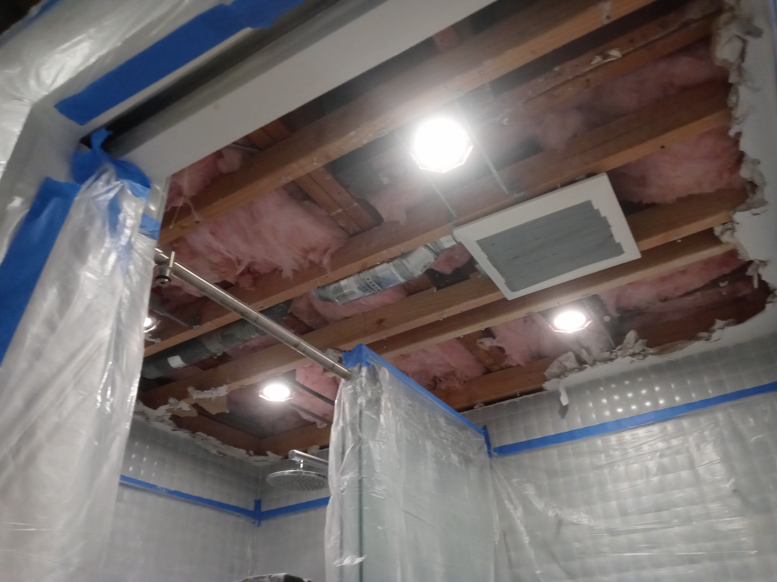Ceiling cavity with old insulation before soundproofing work