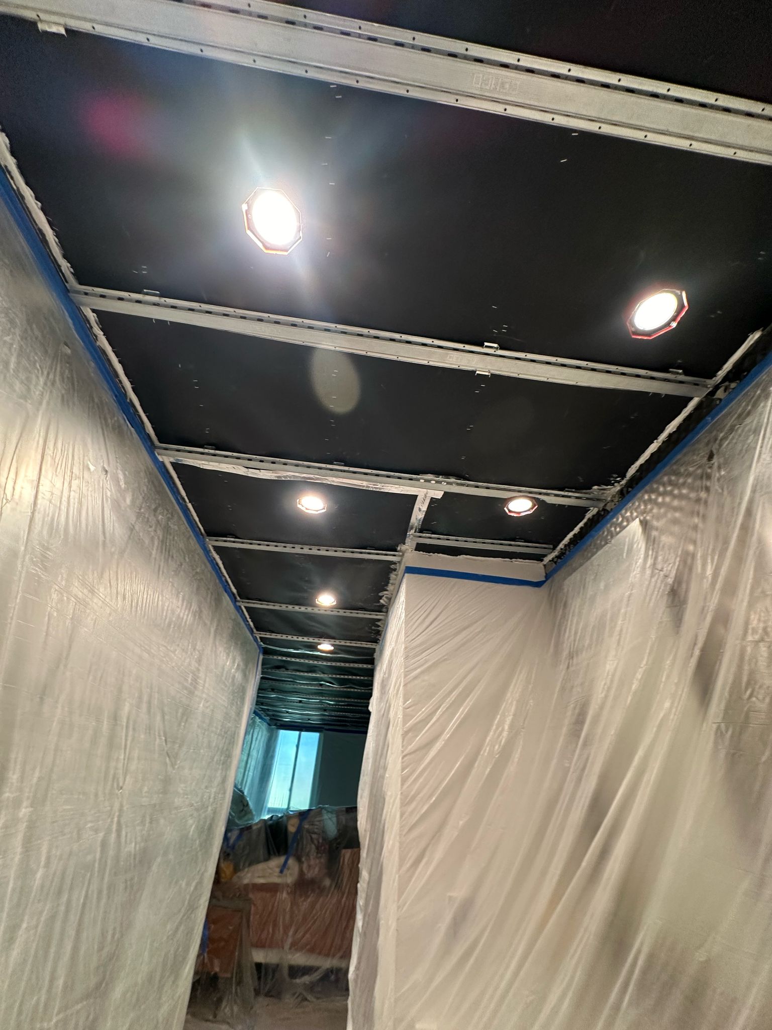 Mass-loaded vinyl and resilient channel soundproofing installed