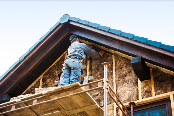 a worker installing insulation