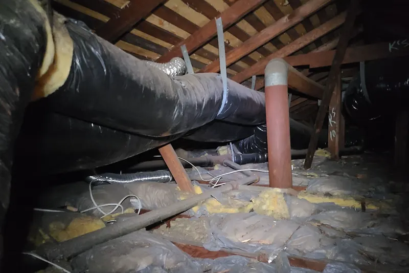The condition of the attic before the attic insulation service - Pure Eco Inc
