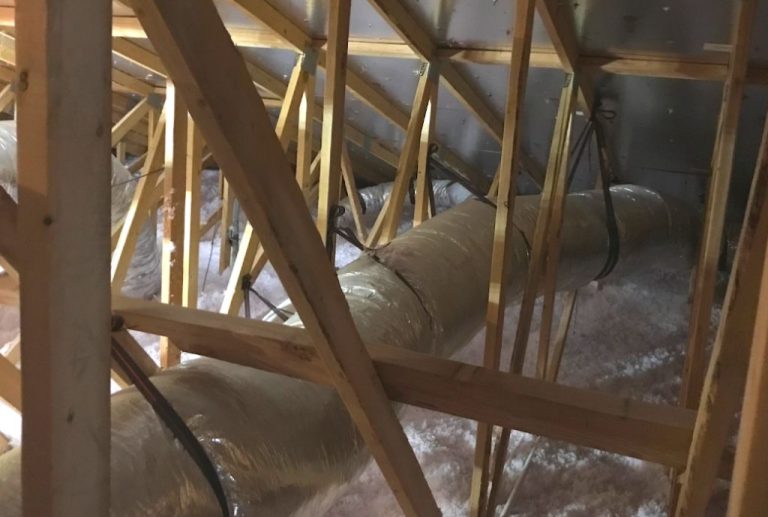 Crawl space insulation and insulated ductwork beneath a Los Angeles home