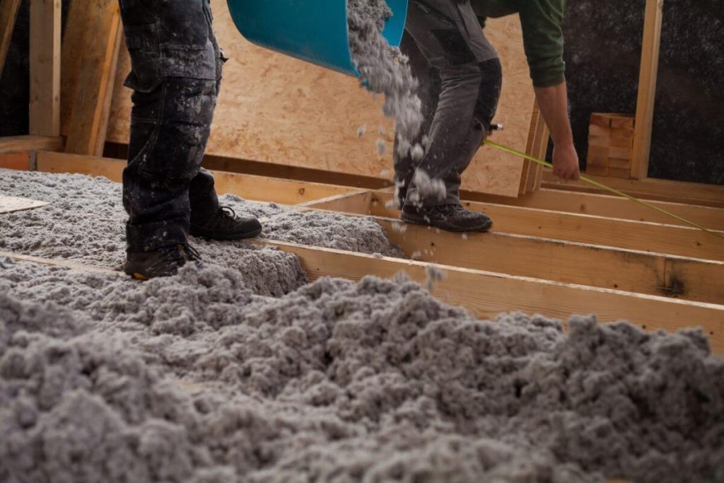 Blown-in attic insulation installation in a Los Angeles home to improve energy efficiency and reduce heat transfer