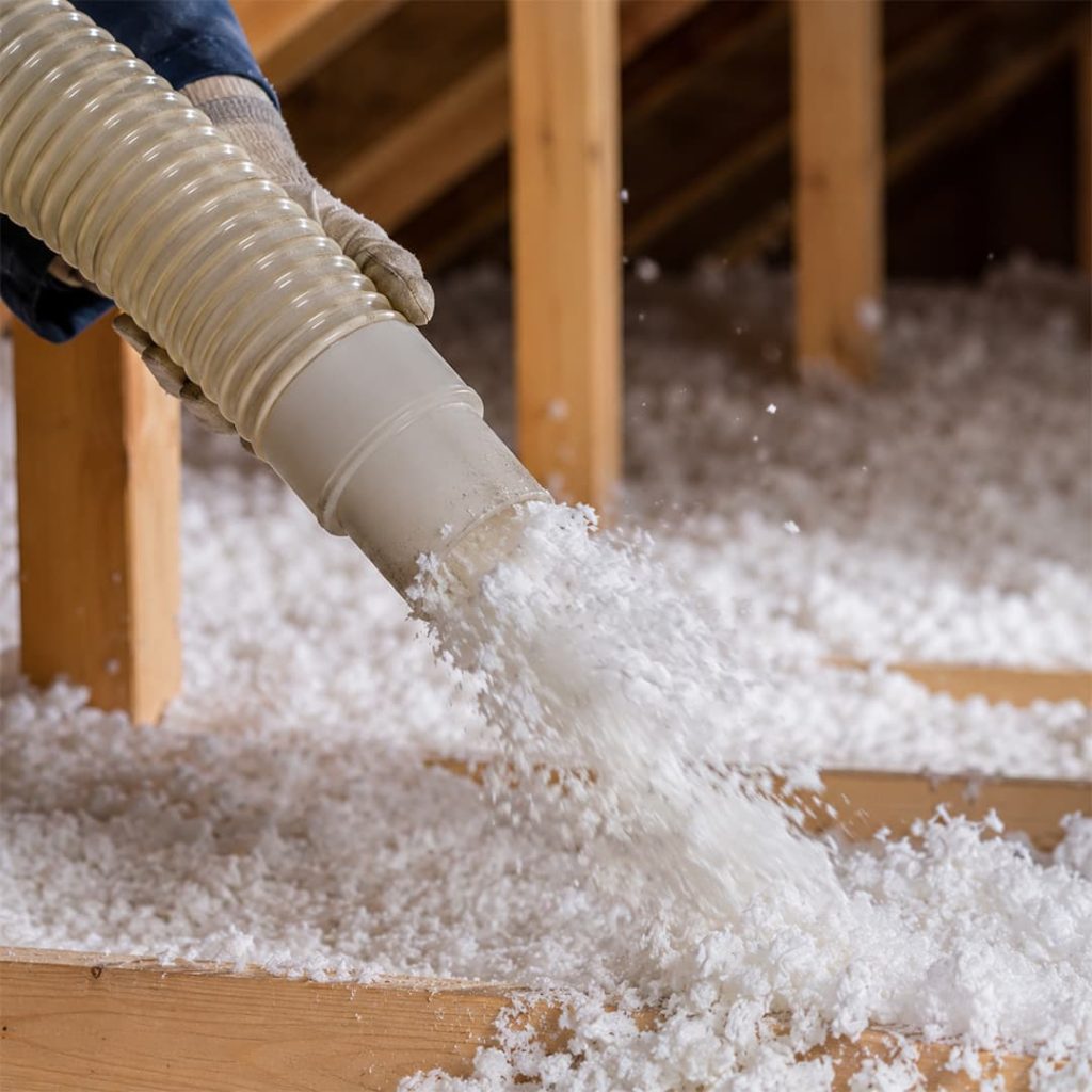 Close-up of blown-in insulation being installed in an attic in Northridge, CA.