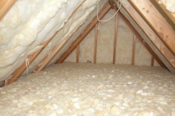 Blown-in cellulose insulation being installed to proper depth across attic floor joists in a North Hollywood home by Pure Eco Inc.