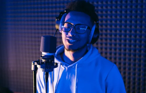 young-male-singer-in-recording-studio-performing